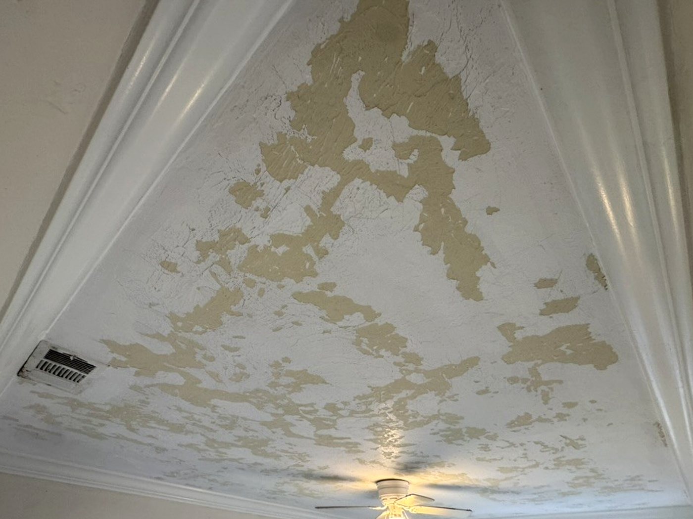 The same style of ceiling scraped back to bare substrate and sanded