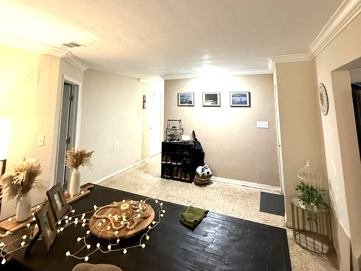 Entry and dining area with a freshly painted ceiling and walls