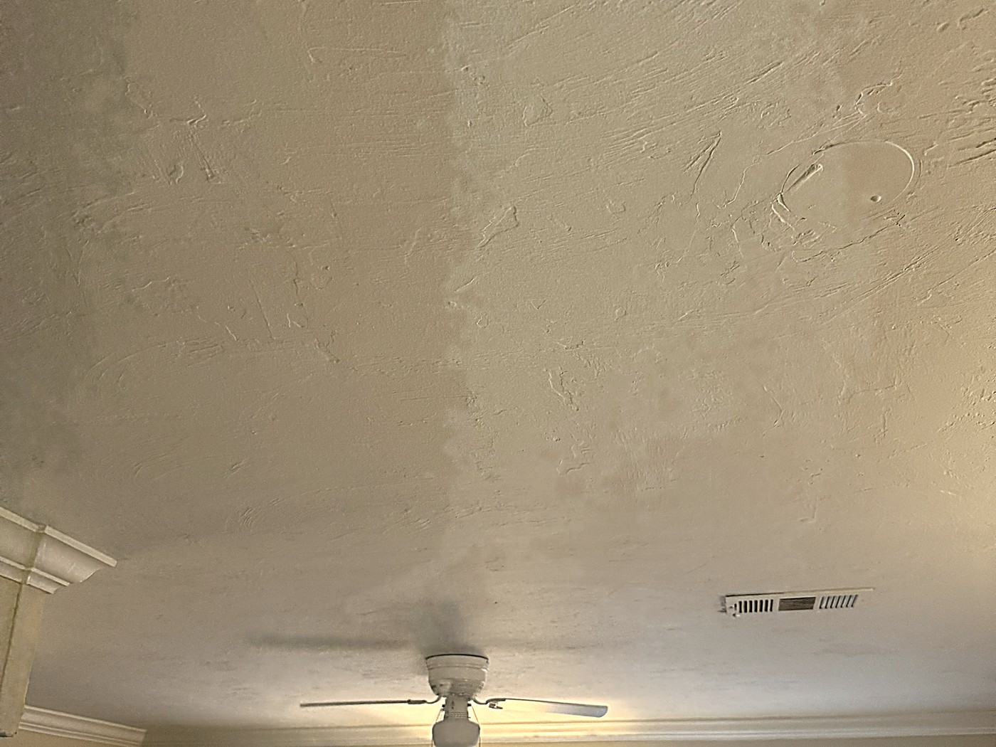 The finished living room ceiling, smooth and repainted