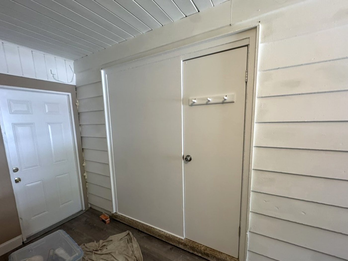 Wider view of the finished wall and door with new flooring