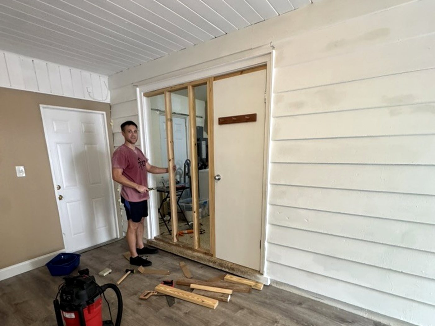 Ryan working on the new stud wall framing between the laundry area and bonus room